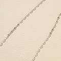Macro shot of silver titanium steel lip chain link showing fine metallic texture and details - Silver Lip Chain