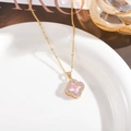 Detail of clover necklace with pink crystal and diamond accents on gold chain - Pink