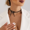 Elegant black beaded choker necklace with a crystal bow pendant on a female model - Black Beads - Gold (ZW094)