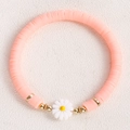 Pink bohemian clay bead bracelet with a white daisy charm and gold-toned accents - Light Pink