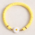 Handmade yellow heishi clay bead bracelet with a white daisy pendant and gold accents - Yellow