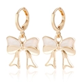 Golden bow drop earrings with pearly white enamel inlay and polished hoop closure - White