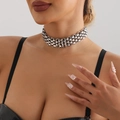 Close-up of triple-layered silver chunky chain choker on neck with industrial metal texture - Necklace / Steel