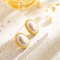 Elegant gold oval pearl stud earrings displayed on a white textured stone pedestal - Oval Pearl Stud Earrings (E189)