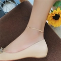 Minimalistische 18K vergulde slangenketting enkelbandje getoond op de enkel stijl - Slangenketting Enkelbandje (288) / Roségoud