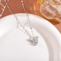 Detailed close-up of a silver elk antler necklace with a large round cubic zirconia - Choker Necklace / White