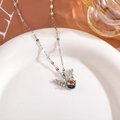 Detail view of elk deer pendant with aurora main stone and pavé zircon wings on a silver chain - Antler Necklace / Colorful
