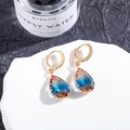 Macro shot of gold teardrop earrings with gradient tourmaline stones on white stone - 12# (Red Blue Cyan Gradient)