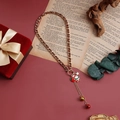 Detailed view of Christmas necklace with Santa pendant and bells on festive background - Santa Claus Figure (ZW2578)