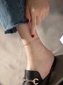 Minimalist golden chain anklet worn on ankle with denim jeans and black loafers - Anklet (261) / Gold