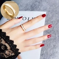 Minimalist gold titanium steel ring with white enamel inlay shown on hand in a close-up - Size 10 US / Gold-White