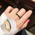 Minimalist gold titanium steel ring with black enamel inlay shown on hand and white background - Size 10 US / Gold-Black
