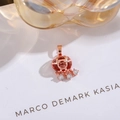 Macro detail of a rose gold safety lock pendant with red gemstone and Chinese Fu character - Longevity Lock-Rose Gold