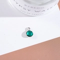 Macro detail of faceted green crystal pendant with silver metal bail on stylized background - Outer Size 6.5x10mm / Peacock Green