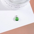 Macro detail of emerald green faceted crystal pendant with silver setting for jewelry - Outer Size 6.5x10mm / Green