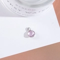 Close-up of a faceted purple crystal round pendant with a polished silver-plated metal border - Outer Size 6.5x10mm / Pink