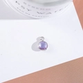 Macro shot of silver-edged round purple crystal pendant for DIY jewelry making and crafts - Outer Size 6.5x10mm / Crystal Purple