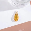Macro shot of faceted yellow crystal teardrop pendant in a gold-plated copper setting - Outer Size 11x25mm / Gold