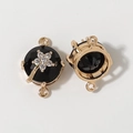 DIY jewelry connector with black faceted stone and silver rhinestone flower in gold frame - Black
