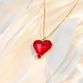 Fashionable heart necklace with colorful zircon and red gemstone on a golden chain - Red