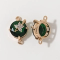 Detailed macro view of gold plated green gemstone jewelry connector for DIY necklaces - Dark Green