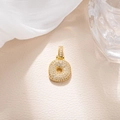 Detail of gold letter O pendant with pave cubic zirconia on beige leather background - Letter O (BGQZM003)