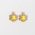 Close-up of 12mm gold-plated six-leaf flower pendants for DIY jewelry making - Gold