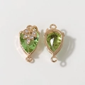 Detail of rose gold pear-shaped green gemstone pendants with leaf and zircon accents - Green