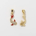 Macro detail of koi carp pendant with gold base, red enamel fins and sparkling zircon inlay - Red