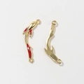 Macro detail of koi fish alloy pendant with red enamel finish and white zircon stones - Burgundy