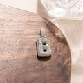 Close-up of silver letter B pendant with micro-pave zircons for hip hop style necklace - Letter B
