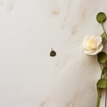 Detailed close-up of a teardrop-shaped green gemstone pendant with simple metal edging - Dark Brown