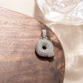 Macro view of micro-paved zircon letter Q pendant with polished silver finish - Letter Q