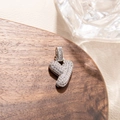Macro shot of a silver letter Y pendant with cubic zirconia in hip hop style - Letter Y