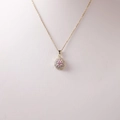 Elegant gold pear-cut pink sapphire pendant necklace with halo crystals on white bust - Waterdrop Halo Design / Gold With Pink Stone Surrounded By Rhinestones