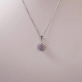 Detailed view of a pear-shaped pink gemstone necklace with white diamond halo setting - Silver With Pink Main Stone