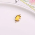 Connettore rettangolare in cristallo giallo sfaccettato con bordo dorato e doppi anelli - Oro