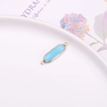 Light blue oval faceted crystal connector charm with gold plated edge and double loops - Lake Blue Jade
