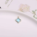 Pendentif trèfle à quatre feuilles bleu clair avec bord doré pour bijoux à faire soi-même - Pendentif Sertissage Trèfle / Bleu lac