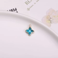 Pendentif étoile à quatre branches bleu ciel avec cadre en cuivre doré pour bijoux - Pendentif Sertissage Trèfle / Bleu Paon