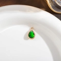 Pear-shaped emerald green faceted crystal pendant with textured gold plated bezel - Peacock Green