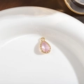 Pink pear-cut crystal pendant with gold-plated decorative edge and top loop - Pink
