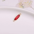 Oval red crystal connector charm with gold plated trim and double loops for DIY jewelry - Red