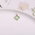 Pendentif trèfle à quatre feuilles en cristal vert clair avec bordure dorée pour bijoux - Pendentif Sertissage Trèfle / Vert clair