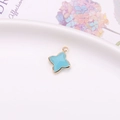 Pendentif étoile à quatre branches bleu ciel avec bordure dorée pour bijoux DIY - Pendentif Sertissage Trèfle / Jade Bleu Lac