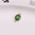 Oval DIY crystal connector charm with emerald green gemstone in a gold-plated finish - Green
