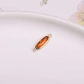 Amber oval faceted crystal pendant with gold-plated bezel and double loops for DIY jewelry - Reddish Brown