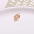 Oval connector with light pink faceted stone and gold-plated copper double loops for jewelry - Rose Quartz Color