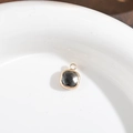 Square faceted grey crystal pendant with gold-plated copper frame and hanging loop - Gray