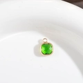 Square emerald green crystal pendant with gold-plated copper bezel setting and jump ring - Green